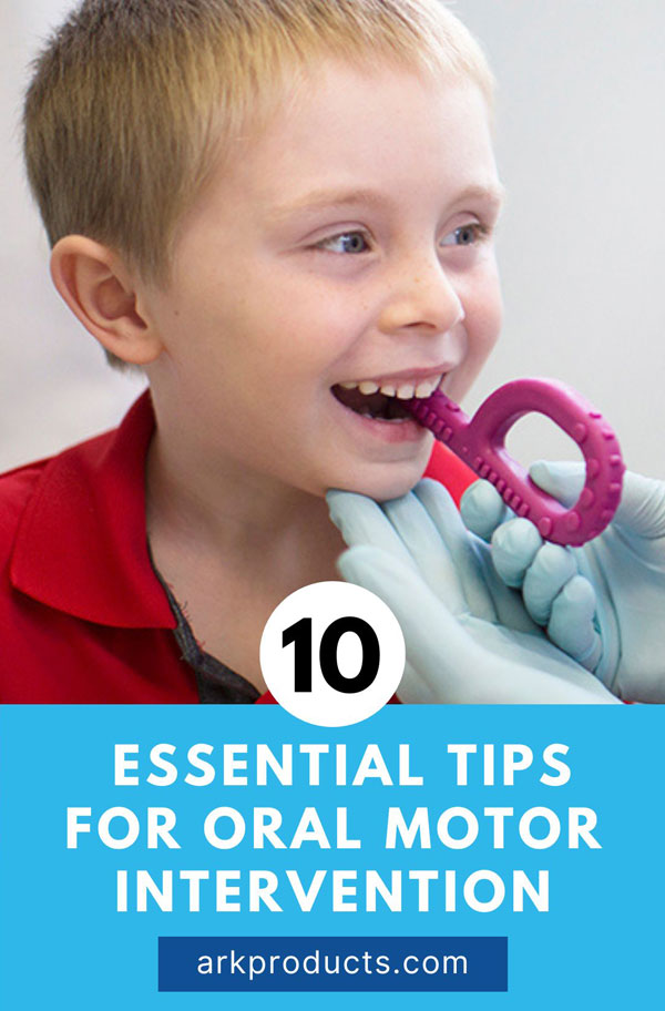 A therapist places the extension of a magenta Textured Grabber P-shaped chew tool in between a boy's premolars so he can bite down and practice chewing