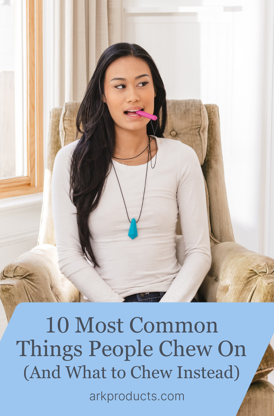 A young adult women chews on a hot pink Krypto-Bite Gem Necklace.