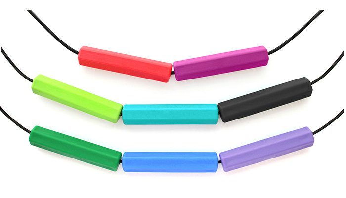 Three cords with multiple pendants of the Krypto-Bite chewable tube on each cord
