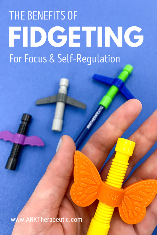 How Fidgeting Improves Focus and Self-Regulation Hand holding the Butterfly Wingamajig with other versions in the background and text: How Fidgeting Improves Focus and Self-Regulation