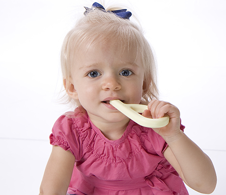 How to Help Little Ones with Big Feelings A little girl bites on the Mini Grabber chew