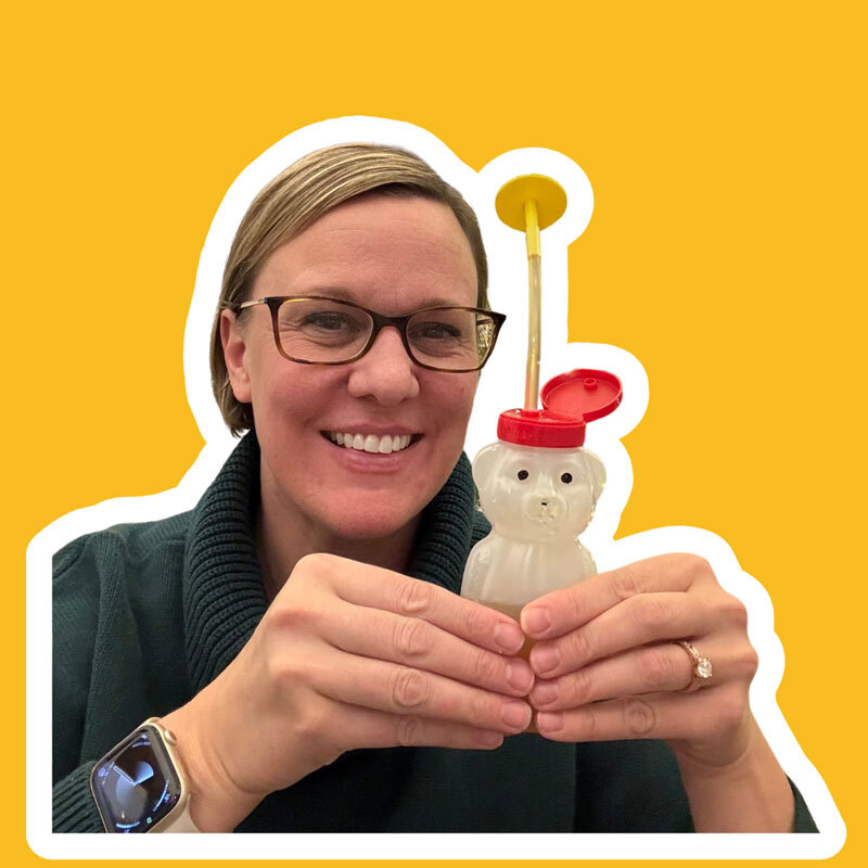 Occupational Therapist Amanda Rae holds the Bear Bottle, showing how squeezable the belly is