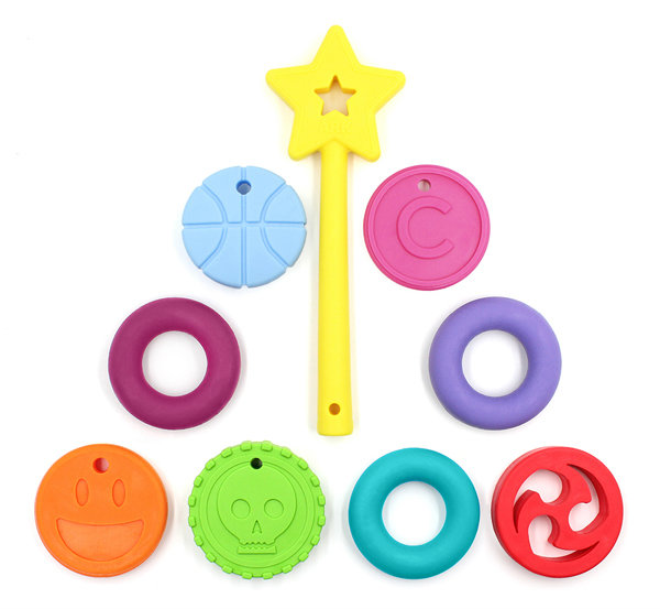 Oral Sensory Stocking Stuffer Ideas ARK chewable necklace pendants laid out to look like a Christmas tree