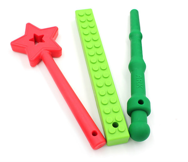 Oral Sensory Stocking Stuffer Ideas The chewable Star Wand, MEGA Brick Stick, and Magic Wand side by side in festive colors
