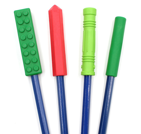Oral Sensory Stocking Stuffer Ideas Side by side view of the Brick Stick, Krypto-Bite, Bite Saber, and Bite-n-Chew chewable pencil toppers in Christmas colors