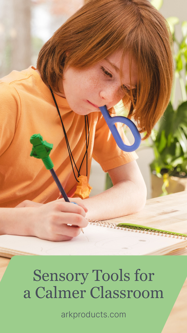 Sensory Tools for a Calmer Classroom A boy chews on an ARK Grabber to focus while writing