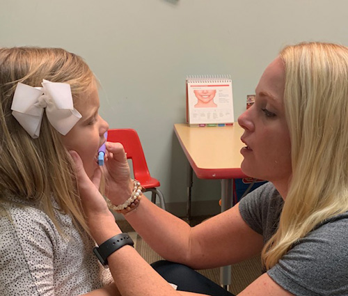 5 Ways to Easily Assess Tongue-Ties Using ONE Simple Tool A therapist uses the Z-Vibe on a patient to look for any restrictions as a sign of tongue tie
