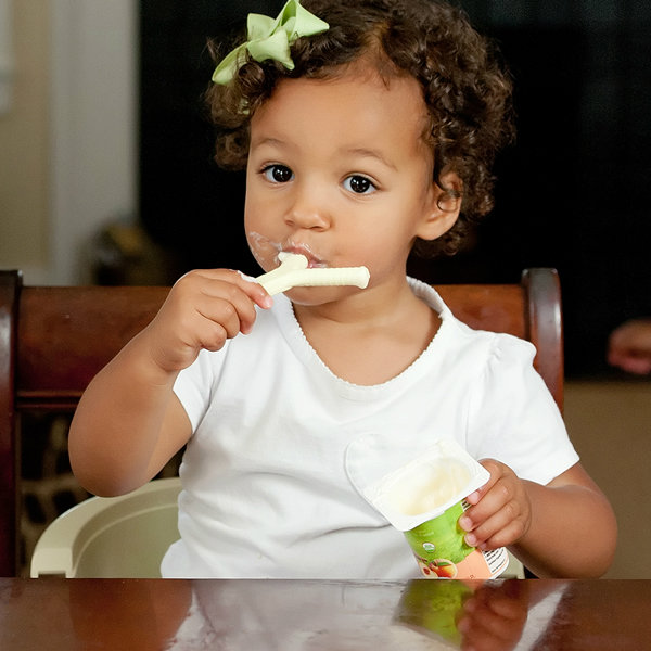 A young girl chews on the Y-Chew oral motor chew